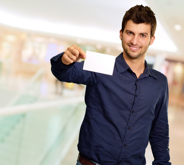 Portrait Of Young Man Holding Blank White Card - Photo, Image
