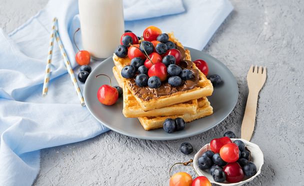 Plate of belgian waffles with chocolate and berries - Photo, Image