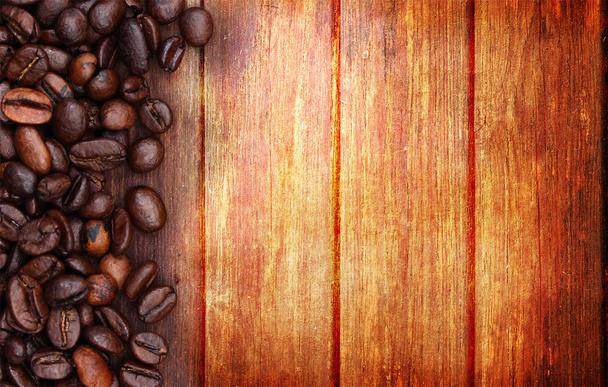 koffiebonen en hout achtergrond - Foto, afbeelding