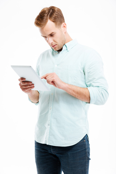 Portrait of a young man using tablet computer - Φωτογραφία, εικόνα