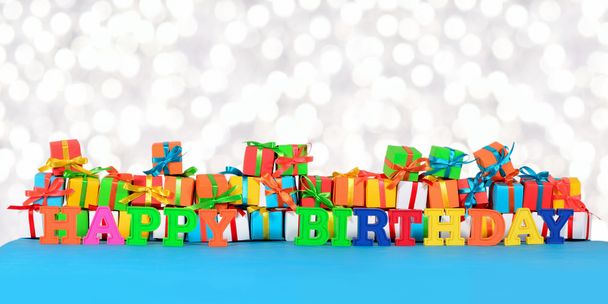Happy birthday colorful text on the background of varicolored gi - 写真・画像