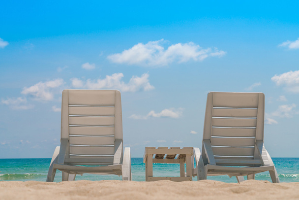 Beach chairs on tropical white sand beach - Fotó, kép