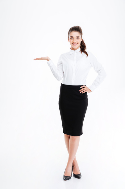 Full length portrait of a businesswoman holding copy space - Foto, immagini