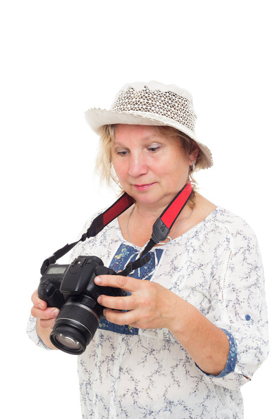 woman learns to hold  photocamera and understand settings - Photo, Image