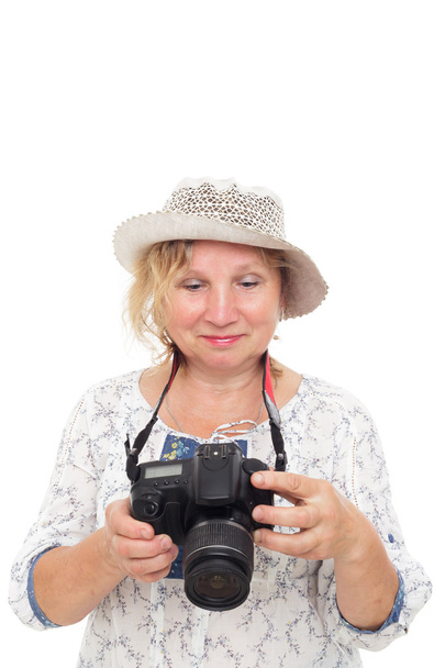 woman learns to hold  photocamera and understand settings - Photo, Image