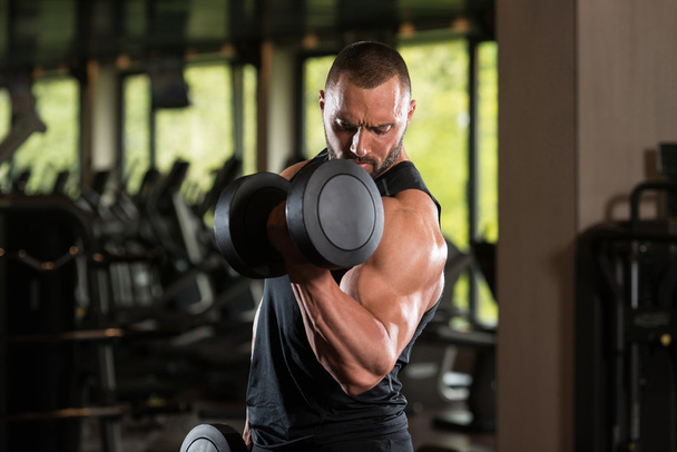 Fitness Muscle Man Exercise Biceps With Dumbbells - Fotó, kép
