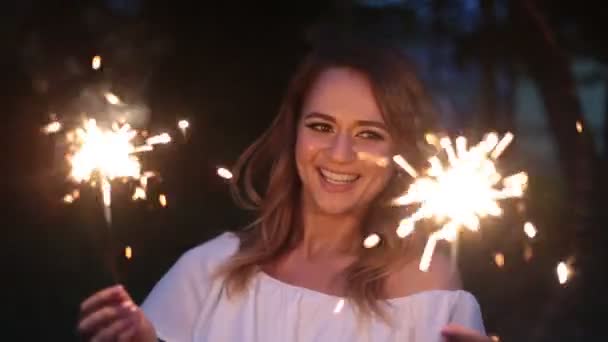 happy young woman with sparklers - Footage, Video