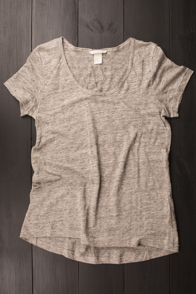 Grey shirt over wood background - Foto, Imagem