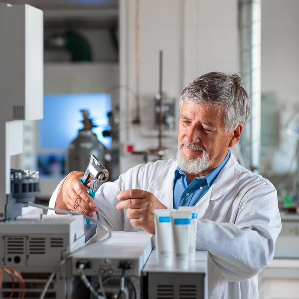 Senior chemistry professor/doctor in a lab (color toned image) - Foto, afbeelding
