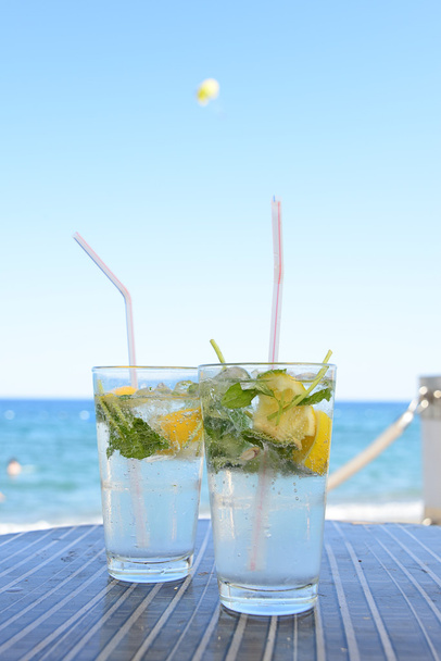 Two glasses of fresh Mojito on the beach cafe - Photo, Image