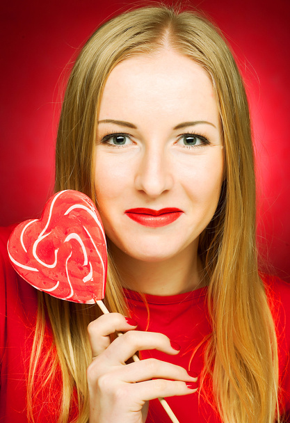 woman holding lollypop - Fotoğraf, Görsel