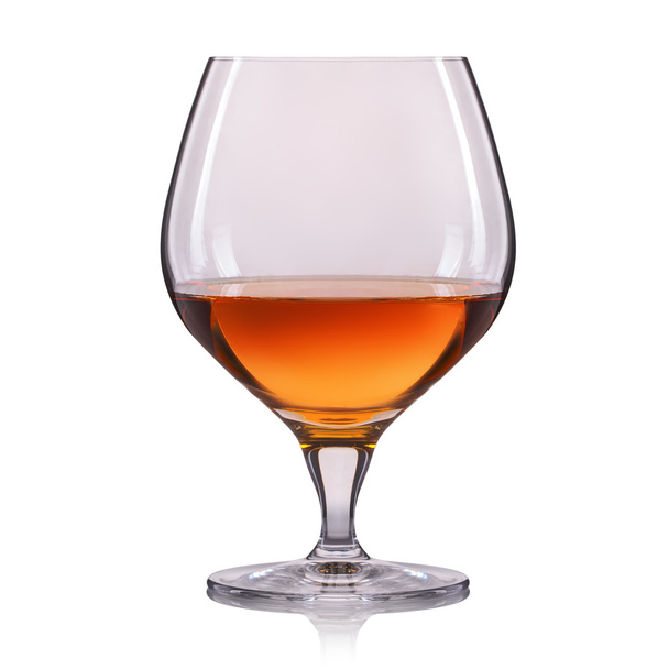 Splash of cognac in glass on white background - Foto, Bild