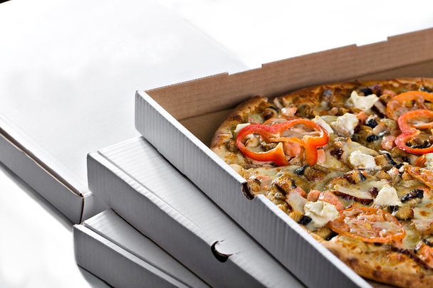rebanadas de pizza casera en caja desde arriba
 - Foto, Imagen