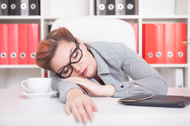 Tired business woman sleeping in office - Foto, Imagem