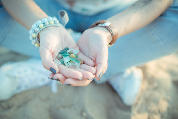 Sea glass pieces in the hands of a woman - Photo, Image