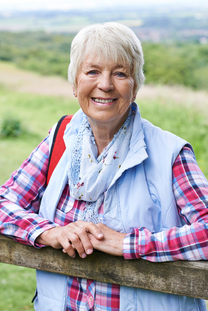 Portrait Of Senior Woman Hiking In Countryside - Zdjęcie, obraz
