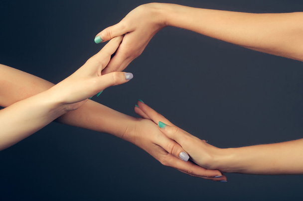 four female hands touching - Foto, afbeelding