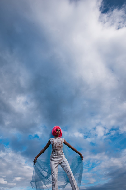 bride with orange hair on blue sky - Valokuva, kuva