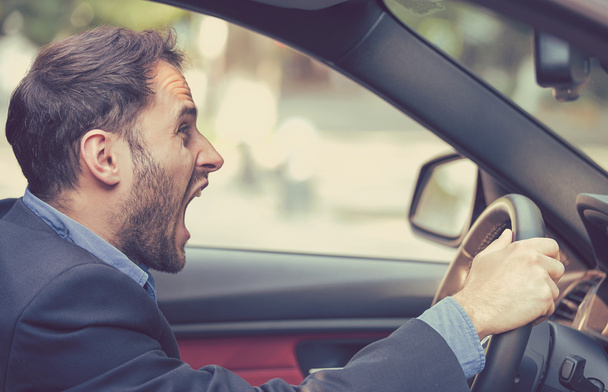 Side profile angry driver. Negative human emotions face expression  - 写真・画像
