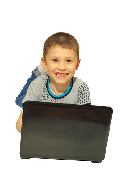 boy with a laptop lying - Photo, Image