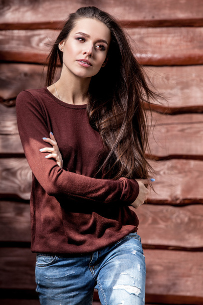 Young sensual & beauty girl pose against grunge wooden background - Photo, image