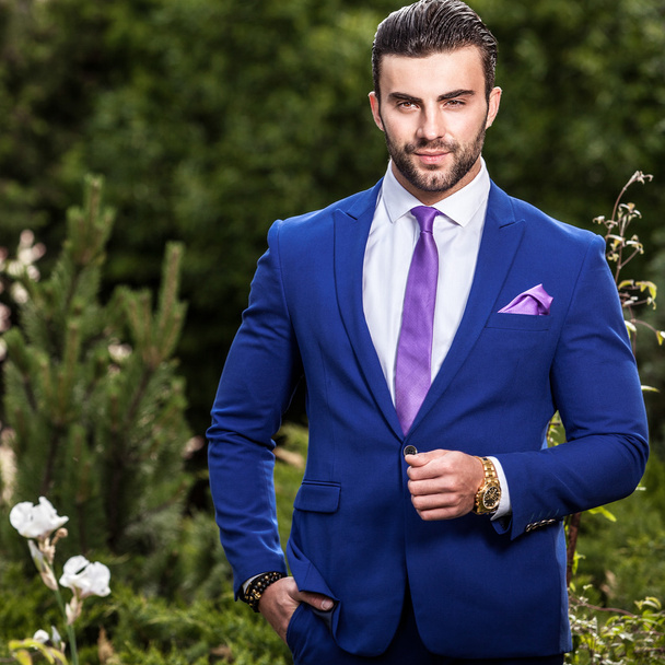 Elegant handsome man in classical blue costume pose outdoor - Φωτογραφία, εικόνα