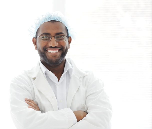 Confident African American male surgeon smiling - Foto, afbeelding
