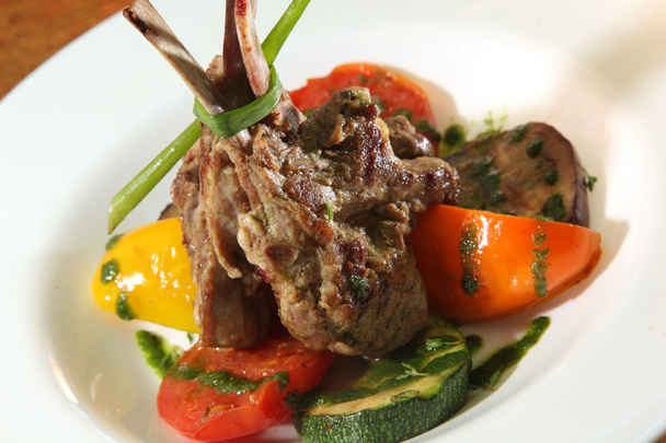Lamb Chops with vegetables and Zucchini on plate - Photo, Image