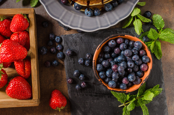 American pancakes with berries and chocolate - Fotó, kép