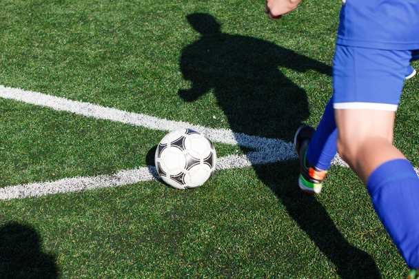 Soccer ball and a player who plays in it. - Photo, image