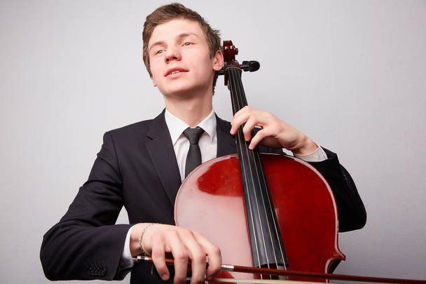 Young man with cello - Zdjęcie, obraz