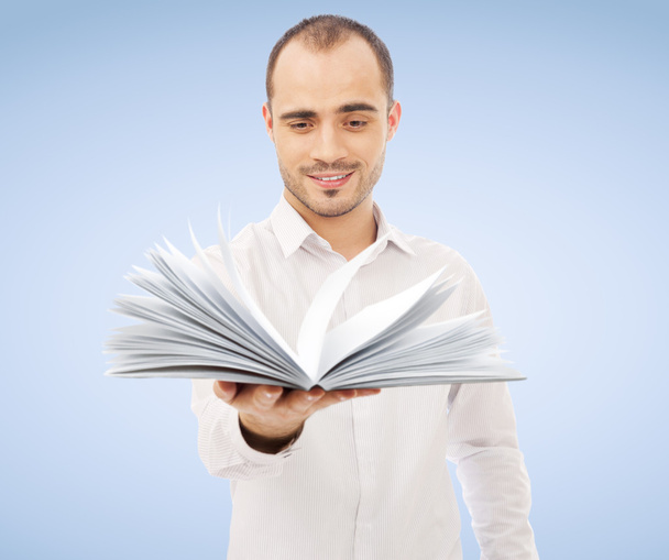 Adult man holding an opened book and reading. Self education of - Fotoğraf, Görsel
