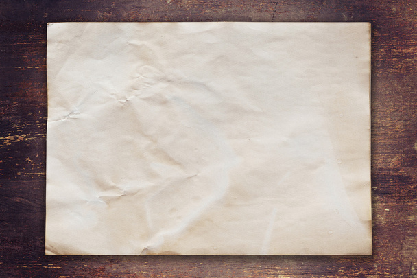 old paper on wood background with space - Photo, Image