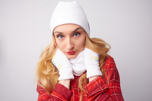 Beautiful girl in white hat and scarf  - Foto, afbeelding