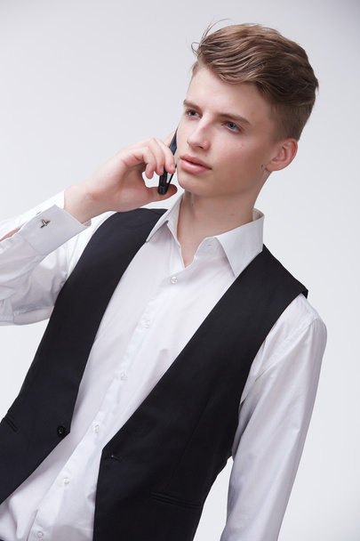 Young confident businessman with phone  - Fotó, kép