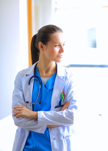 Woman doctor standing at hospital - Fotoğraf, Görsel