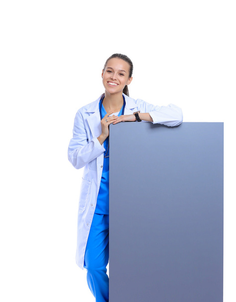 A female doctor with a blank billboard. - Φωτογραφία, εικόνα