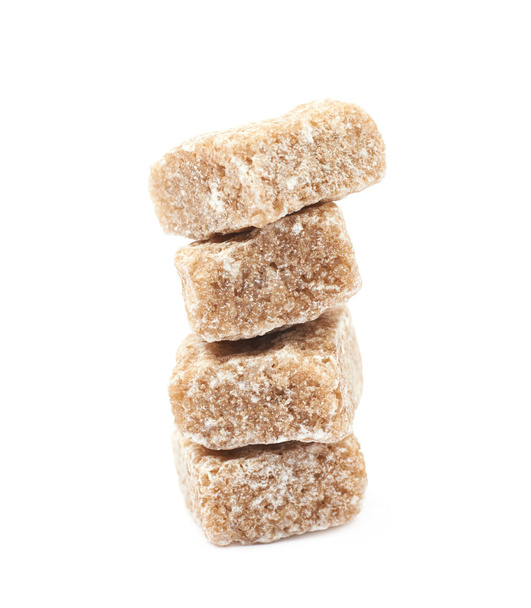 Pile of brown sugar cubes isolated - Foto, Imagen