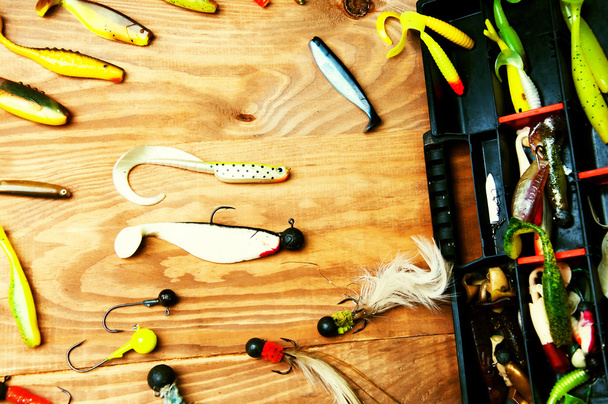 Fishing baits isolated on wooden background - Foto, immagini