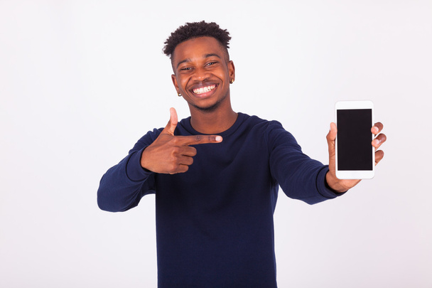 Young African American man pointing his  smartphone screen - Bla - Photo, Image