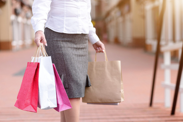 Fashionable lady purchasing in city - Zdjęcie, obraz