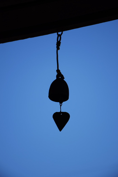 hand bell in back light. - Photo, Image