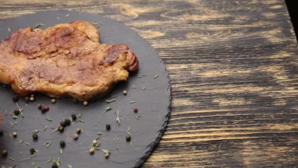 Steak on a wooden table. - Footage, Video