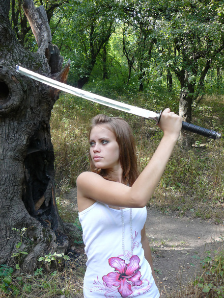 Woman learns to boss a sword - Photo, Image