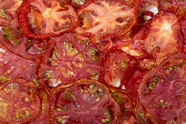 Sun-dried (dried) tomatoes closeup                                                                              - Фото, изображение