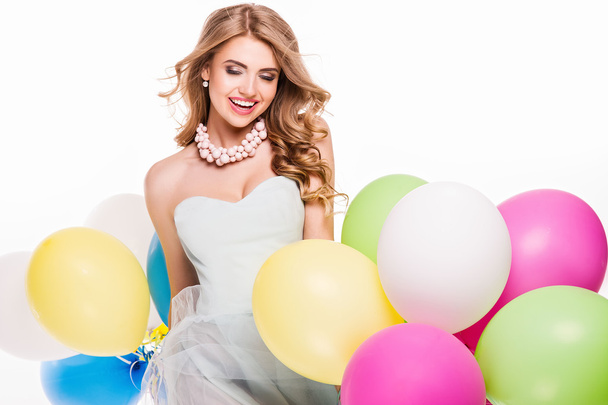 Smiling pretty girl with balloons. - Zdjęcie, obraz