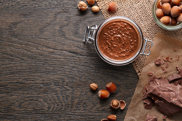 Background with hazelnut spread and ingredients - Photo, Image