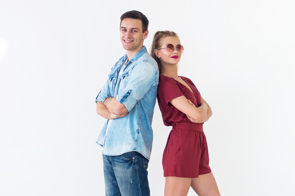 Smiling young couple standing together  - Фото, изображение