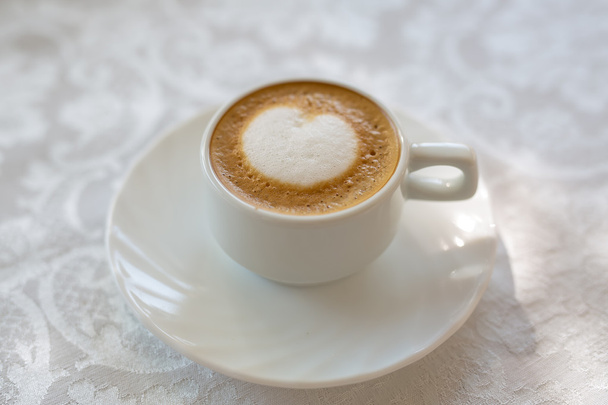 Cup of Cappuccino Coffee with a delicious crema. - Photo, Image