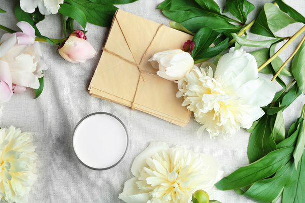 beautiful peony flowers and envelopes  - Fotoğraf, Görsel